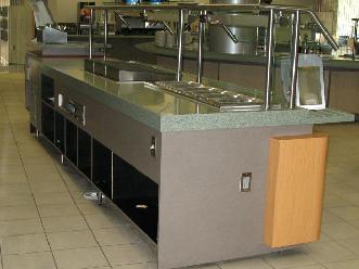Plastic Laminate Servery Casework with Wood Stand-Off Panels and Solid Surface Countertop with Tray Slides